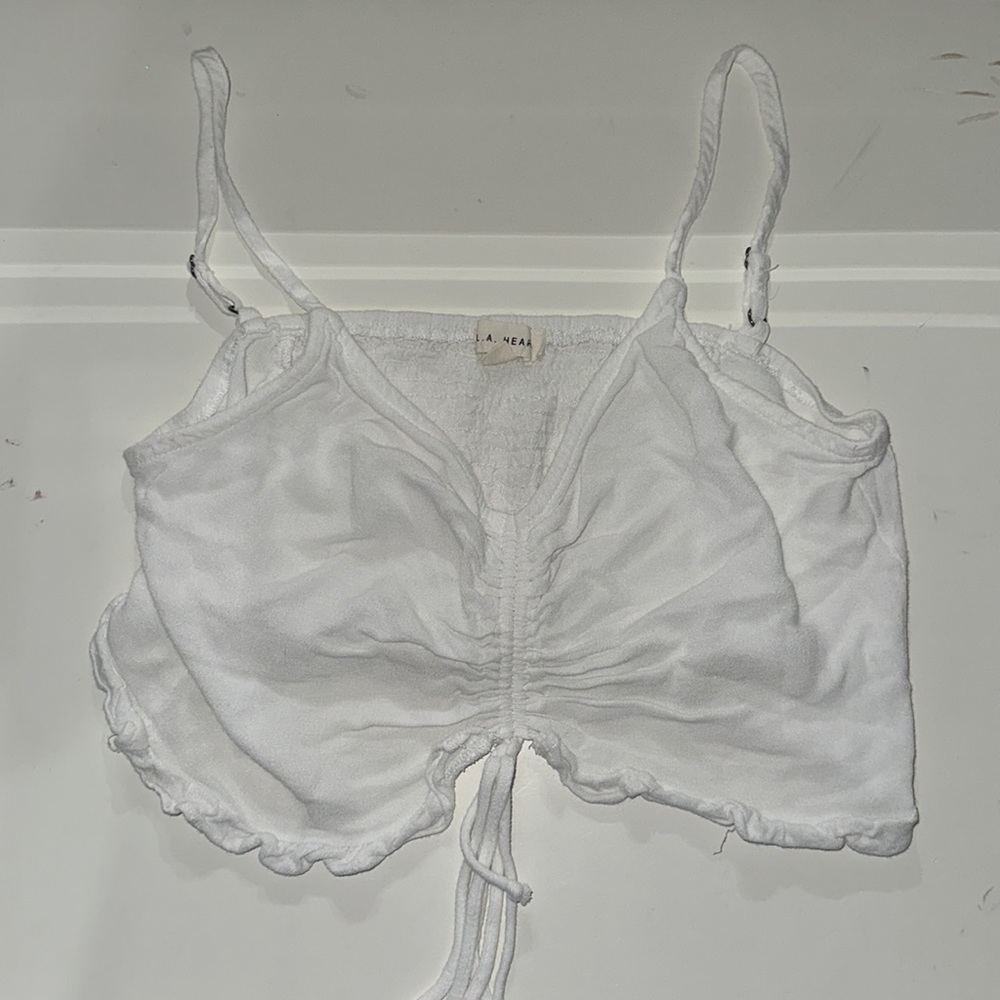 Cute white tank top. Brand L.A. Hearts. Size Medium but sizes run very small!